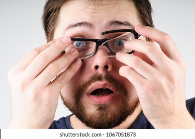 Shocked Man With Broken Glasses On His Face