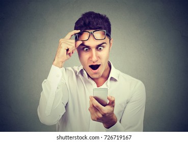 Shocked Man Looking Reading News On Smart Phone 