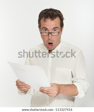 Shocked man reading a document
