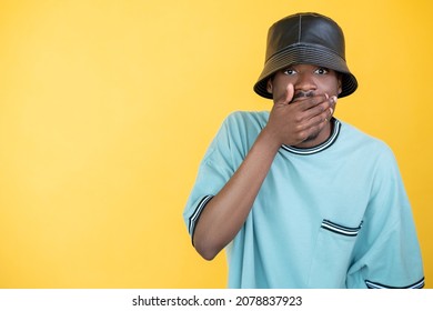 Shocked Man. Trend Style. Advertising Background. Surprised Rapper Guy Expressing Wow Reaction Hand On Mouth Isolated Yellow Copy Space.