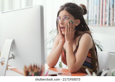 Shocked Panicked Woman Sitting At Desk And Having Computer Problems