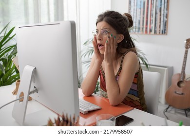 Shocked Panicked Woman Sitting At Desk And Having Computer Problems