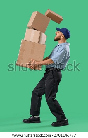 Shocked postman with falling parcel boxes on green background