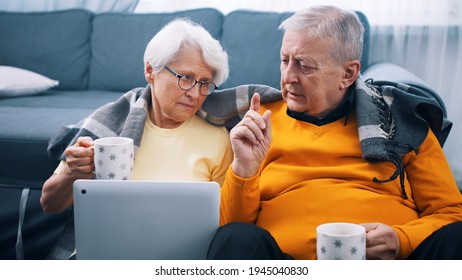 Shocked Retired Couple Watching Tv. Bad News. High Quality Photo