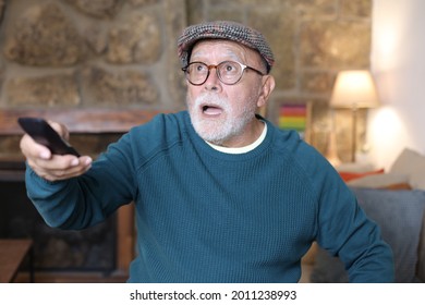 Shocked Senior Man Watching Something On Tv