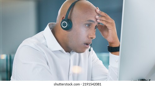 Shocked, Stressed And Annoyed Call Center Agent Having A Bad Day At Work Feeling Unhappy And Having Problems. Tired, Bored And Frustrated Male Customer Service Consultant Looking At His Computer