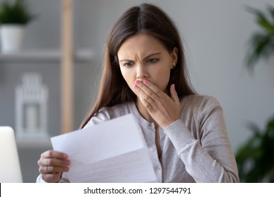 Shocked Stressed Young Woman Reading Document Letter From Bank About Loan Debt Financial Problem, Frustrated Worried About Bills Notification, Troubled With Bad News Or Failed Test Results In Mail