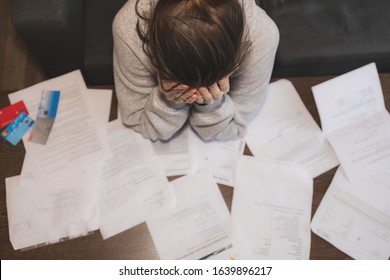 Shocked stressed young woman reading document letter from bank about loan debt financial problem, frustrated worried about bills notification, troubled with bad news or failed test results in mail