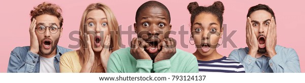 Shocked stupefied dark skinned man and their companions pose against pink background. Emotional surprised horrified mixed race people see something unexpected in front. Human reaction concept