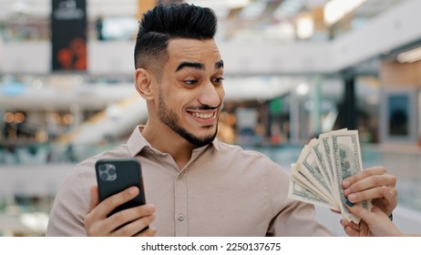 Shocked surprised Ethnic Indian man winner male guy browsing betting with phone online bet casino play with smartphone receive easy money amazed with surprise get cash prize lottery quick loan banking - Shutterstock ID 2250137675
