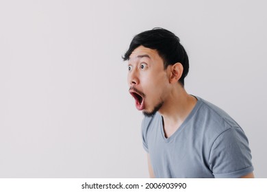 Shocked and surprised face of Asian man in isolated on white background.