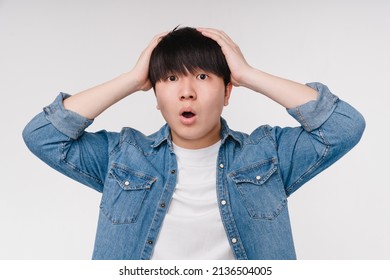 Shocked surprised impressed with bad good news offer discount sale asian korean young man crying loud isolated in white background - Powered by Shutterstock