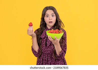 Shocked Teen Child Hold Strawberry Bowl On Yellow Background