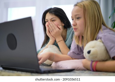 Shocked Teenagers Look At The Laptop. Safe Internet Concept For Kids