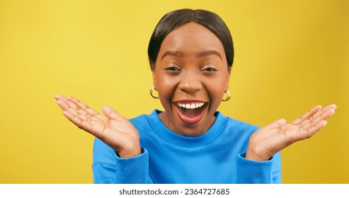 Shocked woman holds palms up in disbelief, yellow studio background - Shutterstock ID 2364727685
