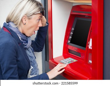 Shocked Woman Looking At Her Bank Account Balance