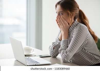 Shocked woman worker looking at laptop screen surprised with bad or unexpected online news, amazed businesswoman feel despair rounding eyes witnessing company bankruptcy or market failure