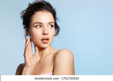 Shocked Young Beautiful Woman With Perfect Skin And Mouth Open Looking Back. Lady Having Surprise Face, Excited Wow Facial Impression