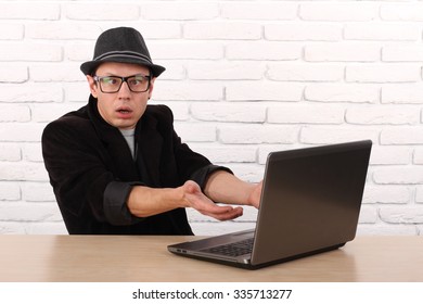 Shocked Young Business Man Using Laptop Looking At Computer Screen Blown Away In Stupor Sitting Outside Corporate Office. Human Face Expression, Emotion, Feeling, Perception, Body Language, Reaction