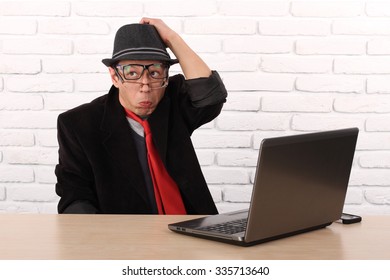 Shocked Young Business Man Using Laptop Looking At Computer Screen Blown Away In Stupor Sitting Outside Corporate Office. Human Face Expression, Emotion, Feeling, Perception, Body Language, Reaction