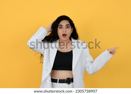 Shocked and Shocked Young Indian Professional Girl Pointing Finger Right - Face Expression and Hand Gesture