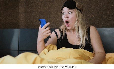 Shocked young woman wakes up with anxiety. Woman overslept - Shutterstock ID 2259118111
