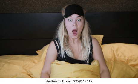 Shocked young woman wakes up with anxiety. Woman overslept - Shutterstock ID 2259118119