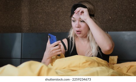 Shocked young woman wakes up with anxiety. Woman overslept - Shutterstock ID 2259234673