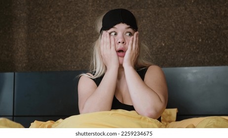 Shocked young woman wakes up with anxiety. Woman overslept - Shutterstock ID 2259234675