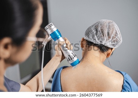 A Shockwave physical therapy, therapy session involves professional using device for physical therapy, creating shockwave effect to enhance healing and recovery