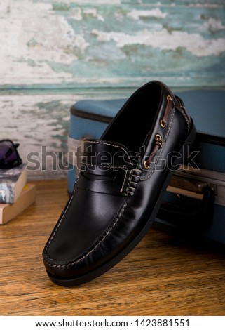 Shoe care accessories on a wooden table - Image