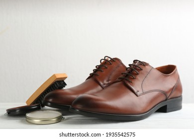 Shoe Care Products And Footwear On White Table