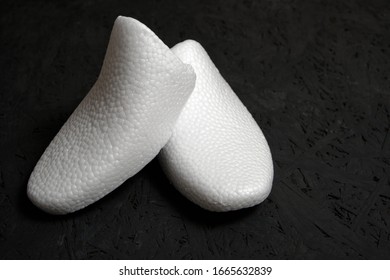 Shoe Form Made Of White Foam On A Black Background