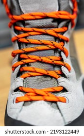 Shoe Lace Close Up Look. Bright Orange Shoelaces. New Mountain Boots