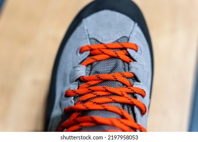 Shoe Lace Close Up Look. Bright Orange Shoelaces. New Mountain Boots