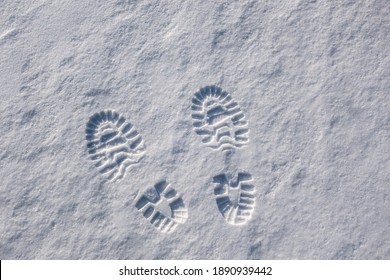 Shoe Print In The Snow. Clear Footprints On White Freshly Fallen Snow. Clear Sunny Winter Day. Space For Text.