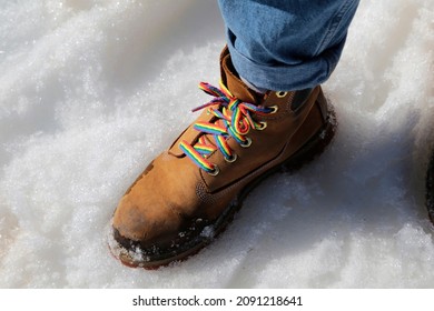 Shoe With Rainbow Laces On Snow