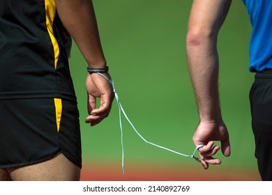 A shoelace serves as a tether between a visually impaired runner and his lane guide at the 2015 Department of Defense Warrior Games at Marine Corps 