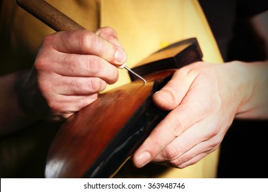 Shoemaker Sews Shoes. 