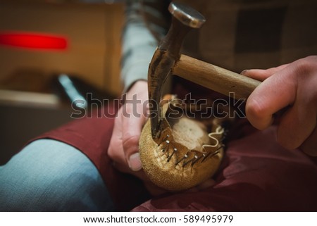 Shoemaker at work