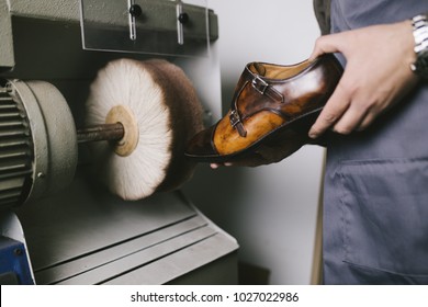 Shoemaker in workshop making leather shoes. - Powered by Shutterstock