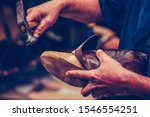 Shoemaker workshop for making shows artisan handmade manufacturing leather shoes. Shoe manufacture business for traditional vintage shoe making, craft shoes in traditional style