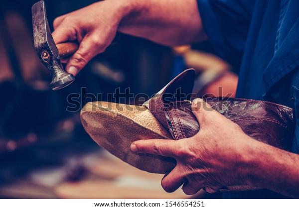 Shoemaker\
workshop for making shows artisan handmade manufacturing leather\
shoes. Shoe manufacture business for traditional vintage shoe\
making, craft shoes in traditional\
style