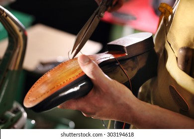 Shoemaker.Shoemaker performs shoes in the studio craft - Powered by Shutterstock