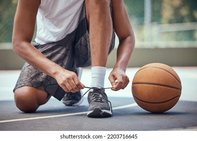 Shoes, Basketball And Sports With A Man Basket Ball Player Tying His Laces On A Court Before A Game Or Match. Workout, Fitness And Exercise With A Male Athlete Outside For Health, Wellness And Cardio