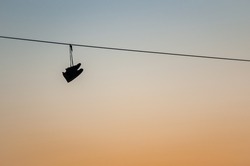 Shoes Hanging On A Telephone Wire