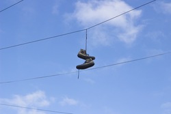 Shoes Hanging From Telephone Wire