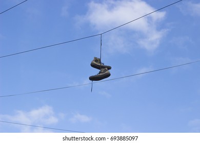 shoes on telephone line
