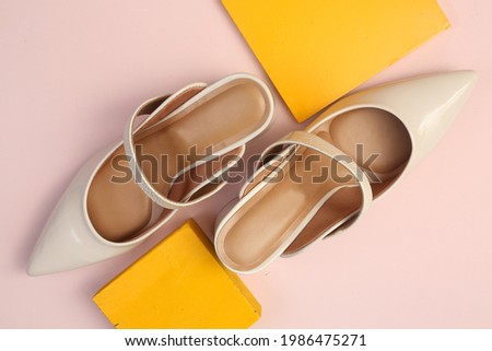 Shoes light brown sandal on pink background