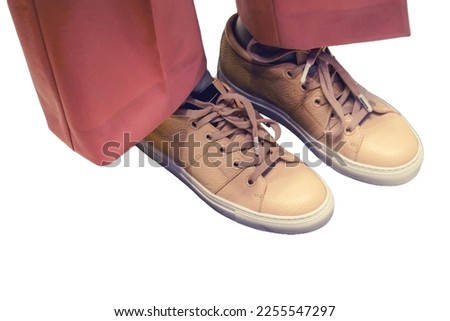 Shoes on the feet of a mannequin in a store, isolated on a white background